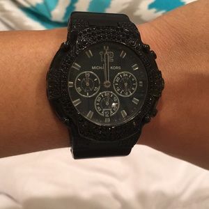 Black Michael Kors watch with black faux diamonds.